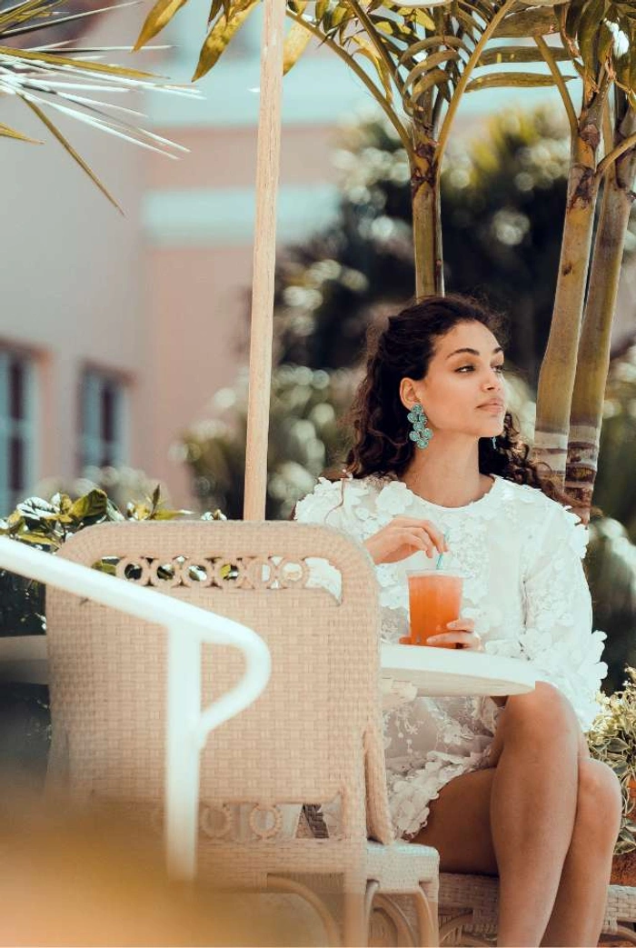 image-neighborhood-02 A lady having a glass of juice at Coral Gables